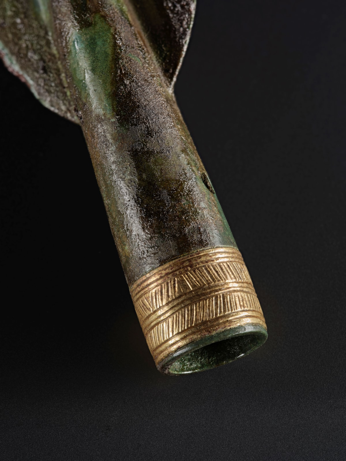 Detail of gold decorated spearhead from the Carnoustie Hoard. Photo © National Museums Scotland