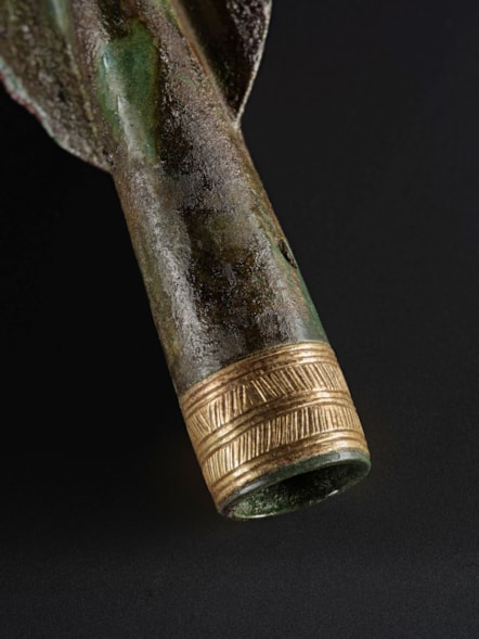 Detail of gold decorated spearhead from the Carnoustie Hoard. Photo © National Museums Scotland