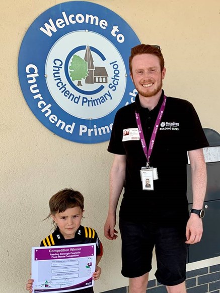 Reception student Beau receives a certificate for winning entry Waster Taster