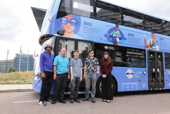 TfL Image - TfL Youth Panel members and bus driver with TfL25 wrapped bus