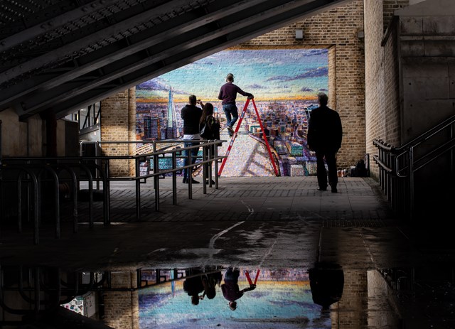 Artist Jimmy C works on his mural at Blackfriars: Artist Jimmy C with his work at Blackfriars