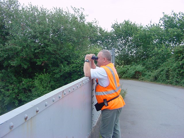 HUMAN SCARECROWS FRIGHTEN OFF RAIL VANDALS IN CARDIFF & NEWPORT: Human scarecrow, patrols Green Lane Bridge, Cardiff