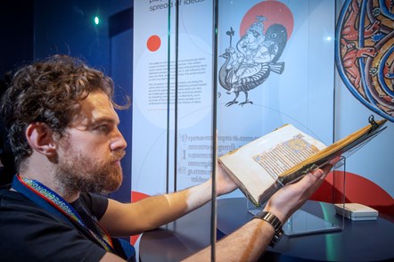 Conservation Exhibitions Specialist Ryan Gibson installing the Iona Psalter. Credit: Neil Hanna