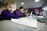 Tackling bureaucracy in schools: Education-class-pupils-reading-primary-school