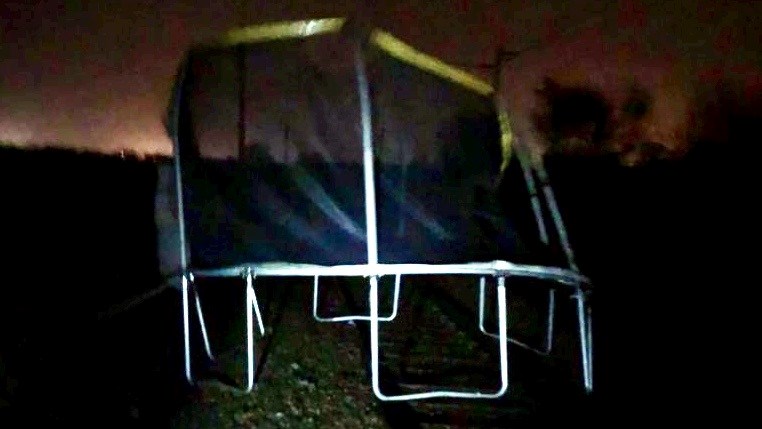 Plea to railway neighbours after airborne trampoline disrupts passengers: Trampoline on track in Hixon, Staffordshire