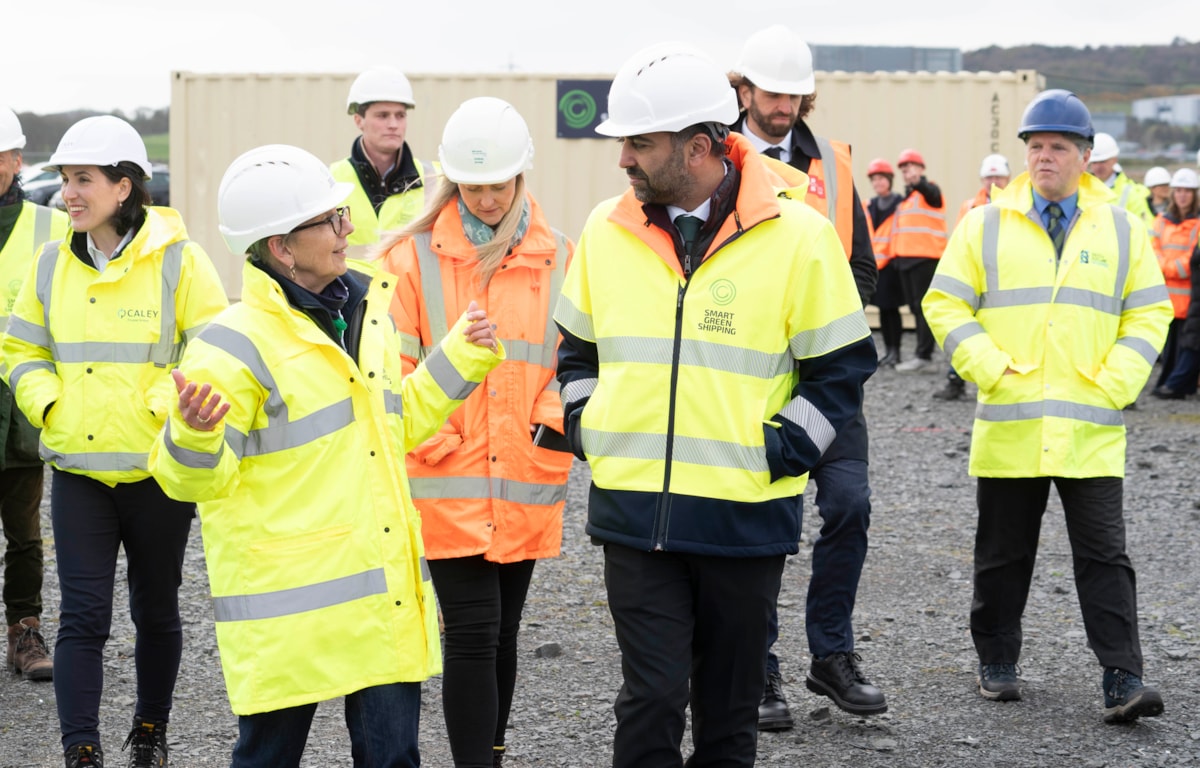First Minister touring site with Di Gilpin and guests