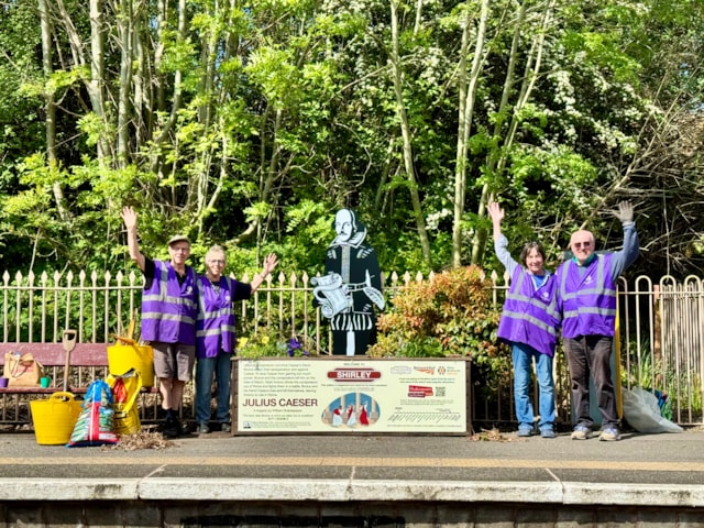 Volunteers installing a Shakespeare statue and planter at Shirley: Volunteers installing a Shakespeare statue and planter at Shirley