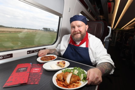 LNER Chef with new First Class dishes sat at table
