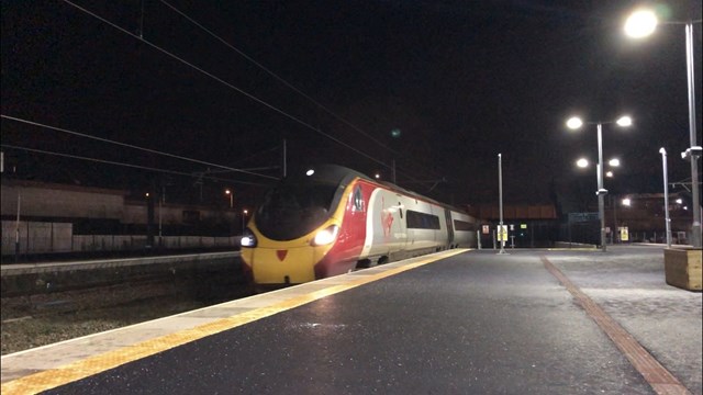 Electric train passing through Bolton station