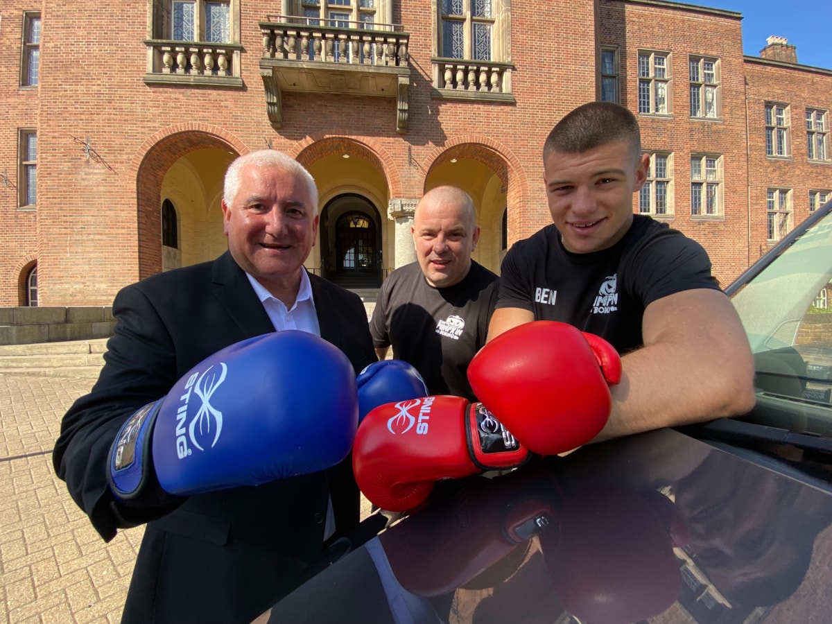 Leader Cllr Pat Harley, Team Pumpking Boxing Club director Carl Collins and local boxer Ben Collins