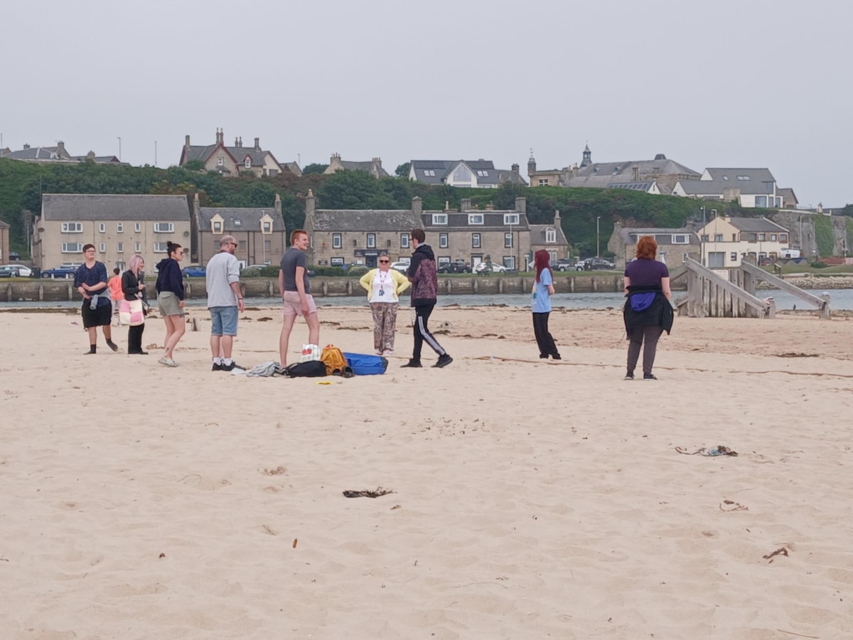 Participants in the Moray Employability programme over summer 2026 take part in team games led by the Youth Work team on Lossiemouth's East Beach.