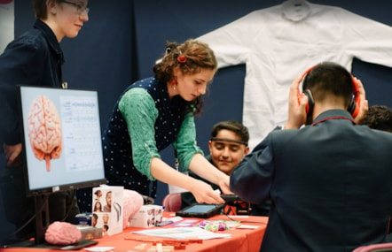 A group of pupils use portable electroencephalogram (EEG) technology to build awareness of the brain and its functioning at the 2024 TeenTech Lancashire Festival.