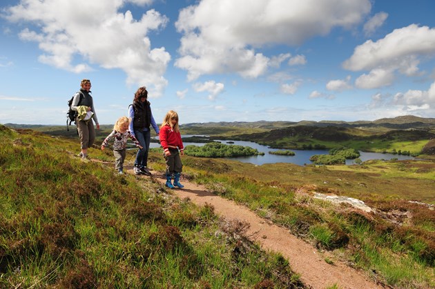 A family enjoying a walk by Loch Beannach on the Little Assynt estate near Lochinver Assynt ©Lorne Gill SNH