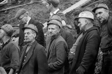 Black and white photograph of miners in the aftermath of the Aberfan Disaster by the photographer David Hurn