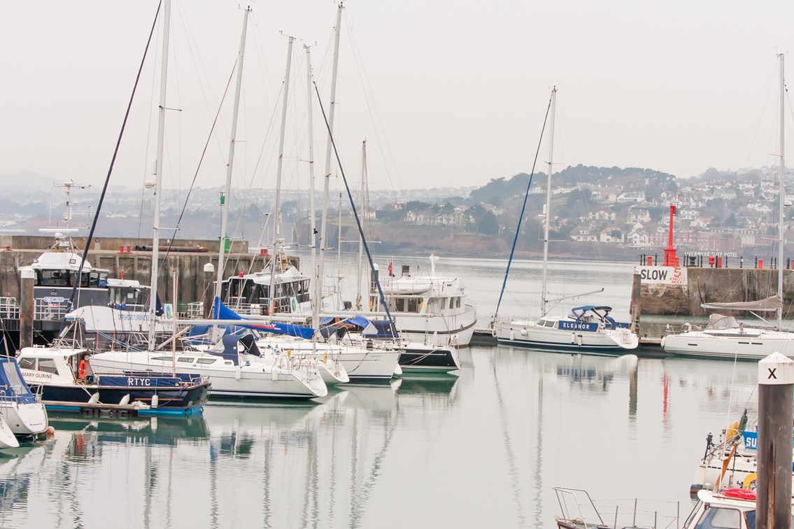 Boats at Teignmouth port: Unmanned Aerial Vehicle (UAV) being launched from a Rigid Inflatable Boat (RIB) at Teignmouth as part of a geological survey to improve the resilience of the railway between Exeter and Newton Abbot
