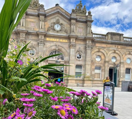 An exterior image of Accrington Town Hall with flowers in the foreground