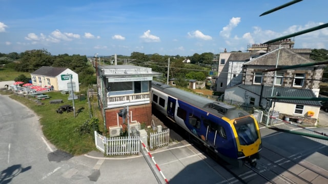 Northern train passing by Hest Bank signal box-2