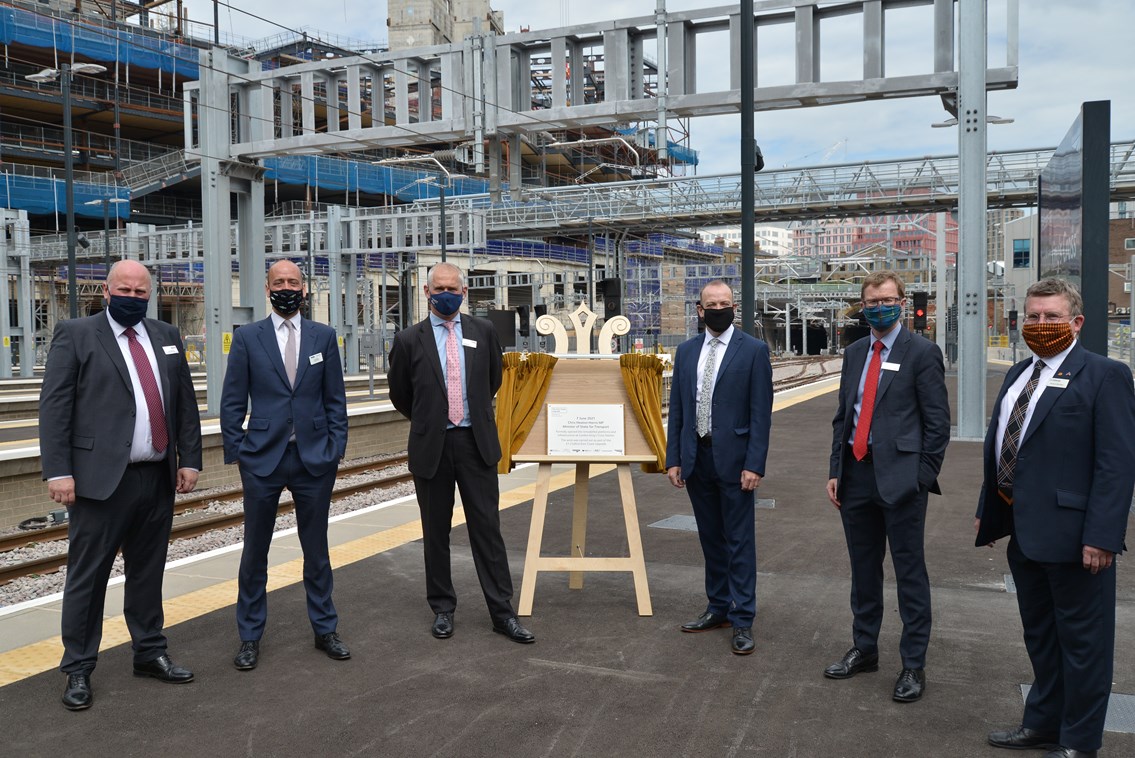 The plaque unveiled at King's Cross to mark completion of the upgrade project. Pictured [from left to right]: Andy Mellors, Managing Director of non-franchised rail businesses, First Group; Tom Moran, Managing Director, Great Northern & Thameslink; Rob McIntosh, Managing Director, Eastern Region, Network Rail; Chris Heaton-Harris MP, Minister of State for Transport; David Horne, Managing Director, LNER and Richard McClean, Managing Director, Grand Central.