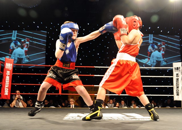 St Joseph's boxer (Jerry Connors in red) v (Everton boxer Lewis Gorman in blue) at the No Messin' Tri-nation boxing competition