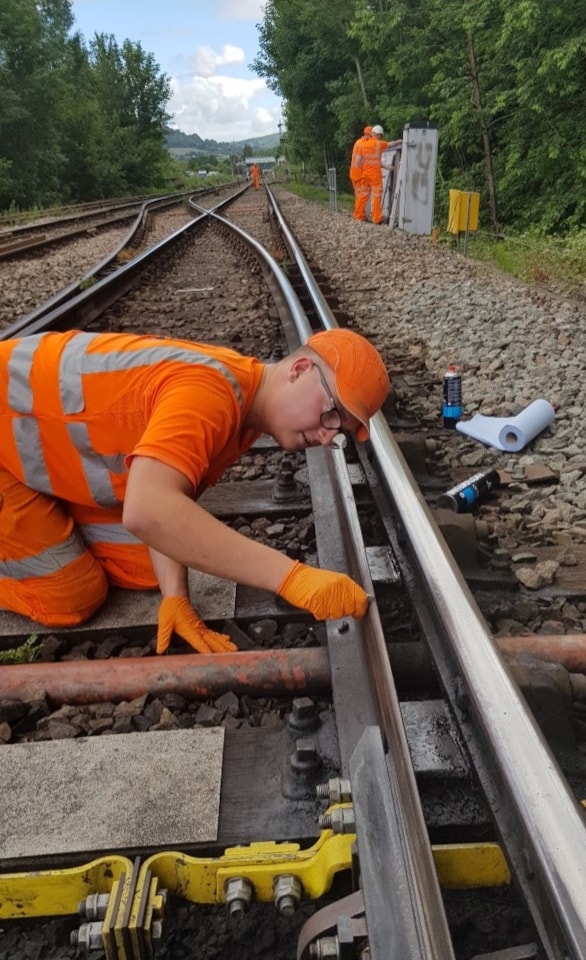 Charles French apprentice fault finding during railway closure