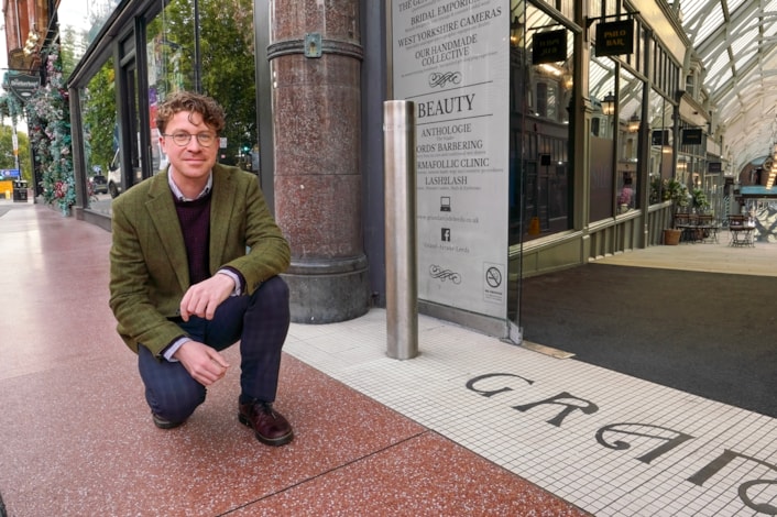 Heritage 2: Councillor Jonathan Pryor (Leeds City Council's deputy leader and executive member for economy, transport and sustainable development) outside the Grand Arcade, where a section of terrazzo paving has been restored during heritage-led improvement work.