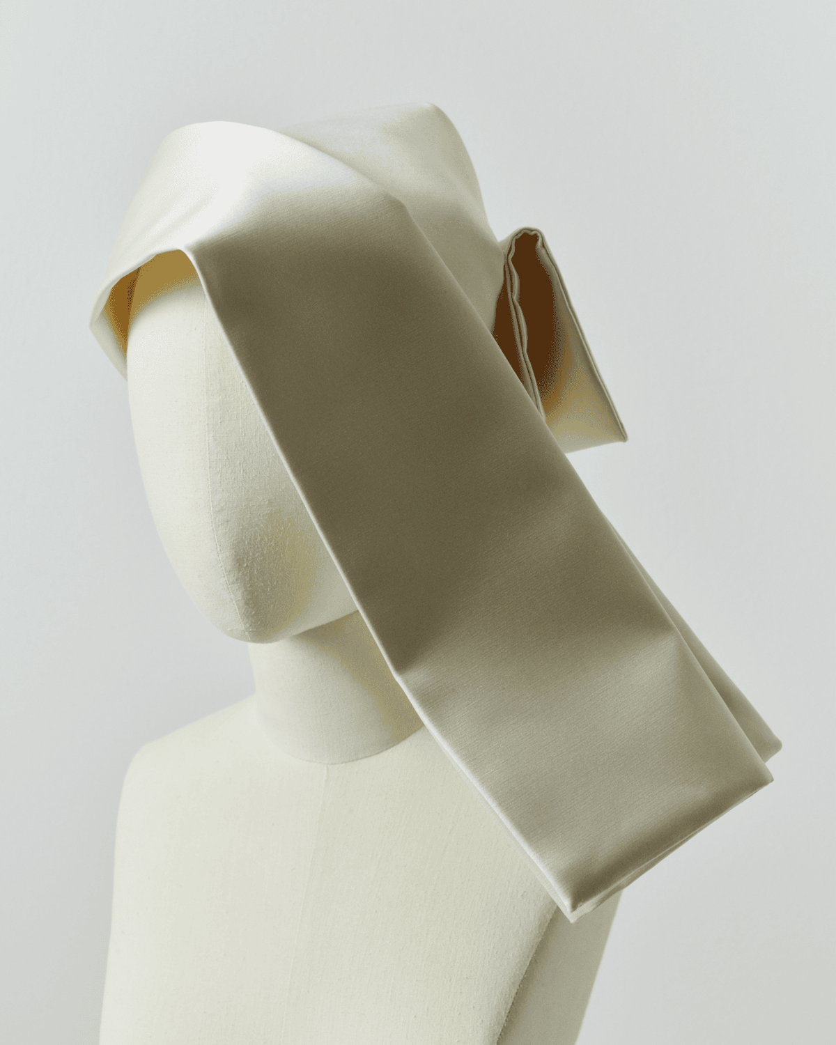 Image of a striking white cornette on a mannequin. 

Image Courtesy of JW Anderson.