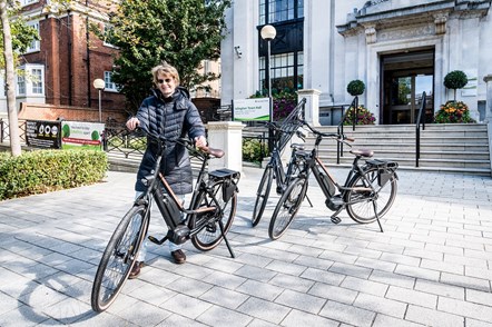 Cllr Rowena Champion with the new e-bikes, which will be used by the Street Environment Services team