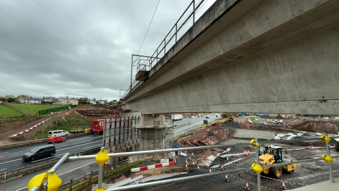 Underside of the existing Clifton bridge with M6 and construction site below