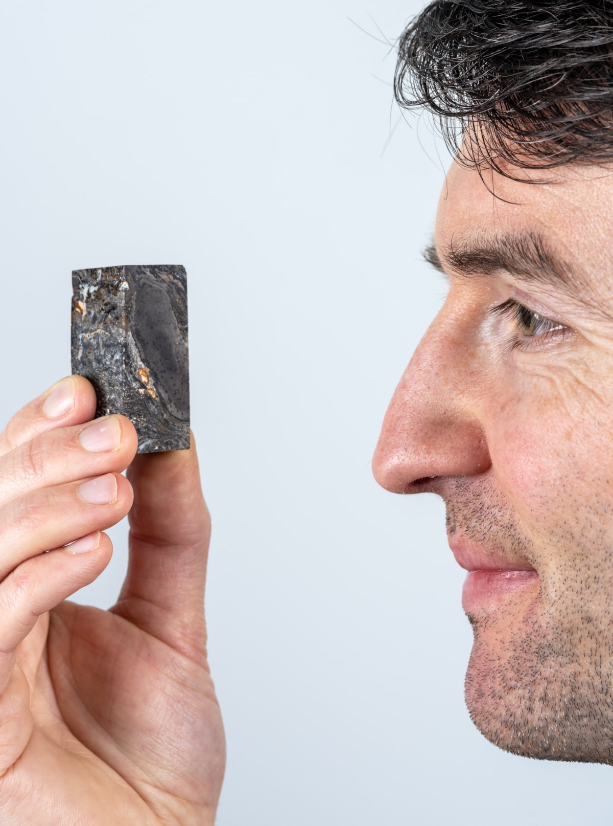 National Museums Scotland Research Associate Sandy Hetherington with sample of the 410 million year-old fossil of Prototaxites