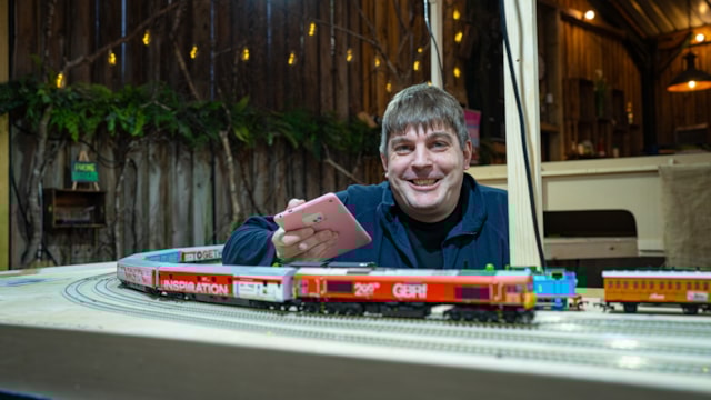 Andrew Willsher with the painstakingly made model Credit Railway 200 (1): Andrew Willsher with the painstakingly made model Credit Railway 200 (1)
