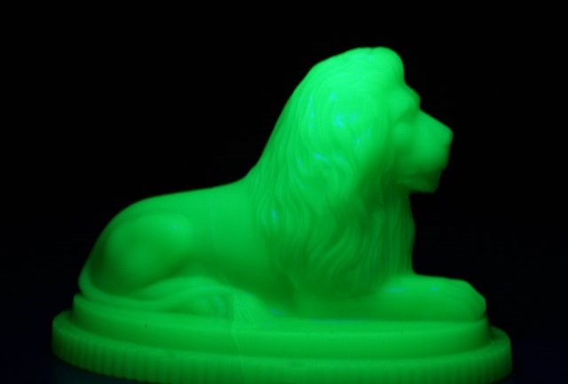 Leeds Museums and Galleries object of the week- glowing glass lion: lionpaperweightinuvlight.jpg