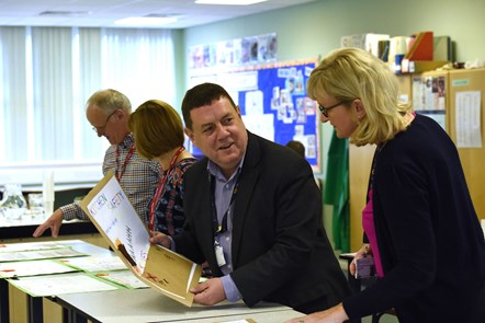 Cllr Reid judging the poster competition