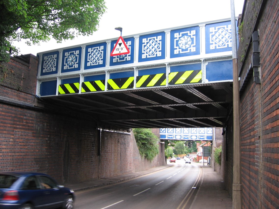 Zodiac bridges_1: Two parallel bridges over Brook Road, Stourbridge, decorated with signs of the zodiac and cut glass motifs.