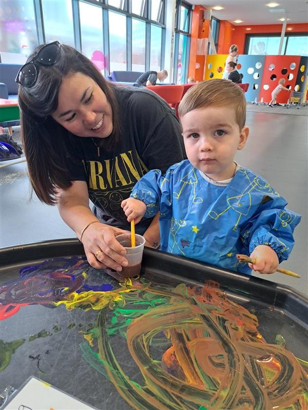 George, who is nearly two, gets stuck into painting at the Skelmersdale Family Hub and the Zone