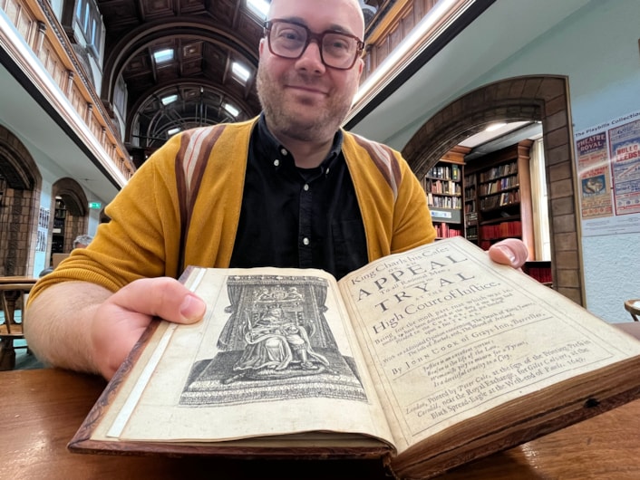 Battle books event: Librarian Josh Flint with the centuries-old court report from the infamous trial of King Charles I, which will be revealed later this month during a fascinating event in Leeds.
The remarkable book was created more than 360 years ago, and recounts in exhaustive detail the unprecedented week-long trial in 1649, which saw the King convicted of tyranny and treason and sentenced to death in the aftermath of the English Civil War.