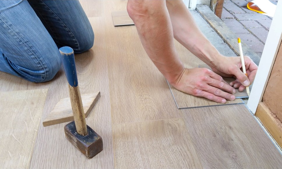 Tradesman working on wooden floor