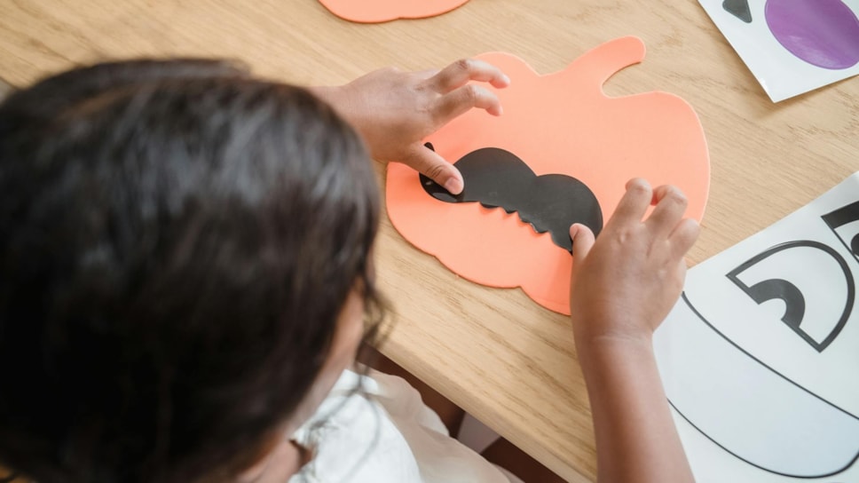 Child doing Halloween craft