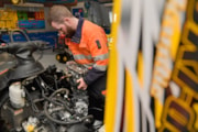 Mechanic working on a Skidoo. BAS.: Mechanic working on a Skidoo. BAS.