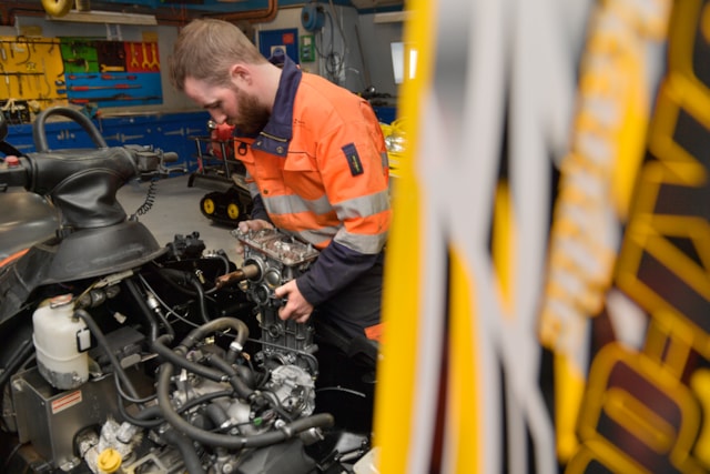 Mechanic working on a Skidoo. BAS.