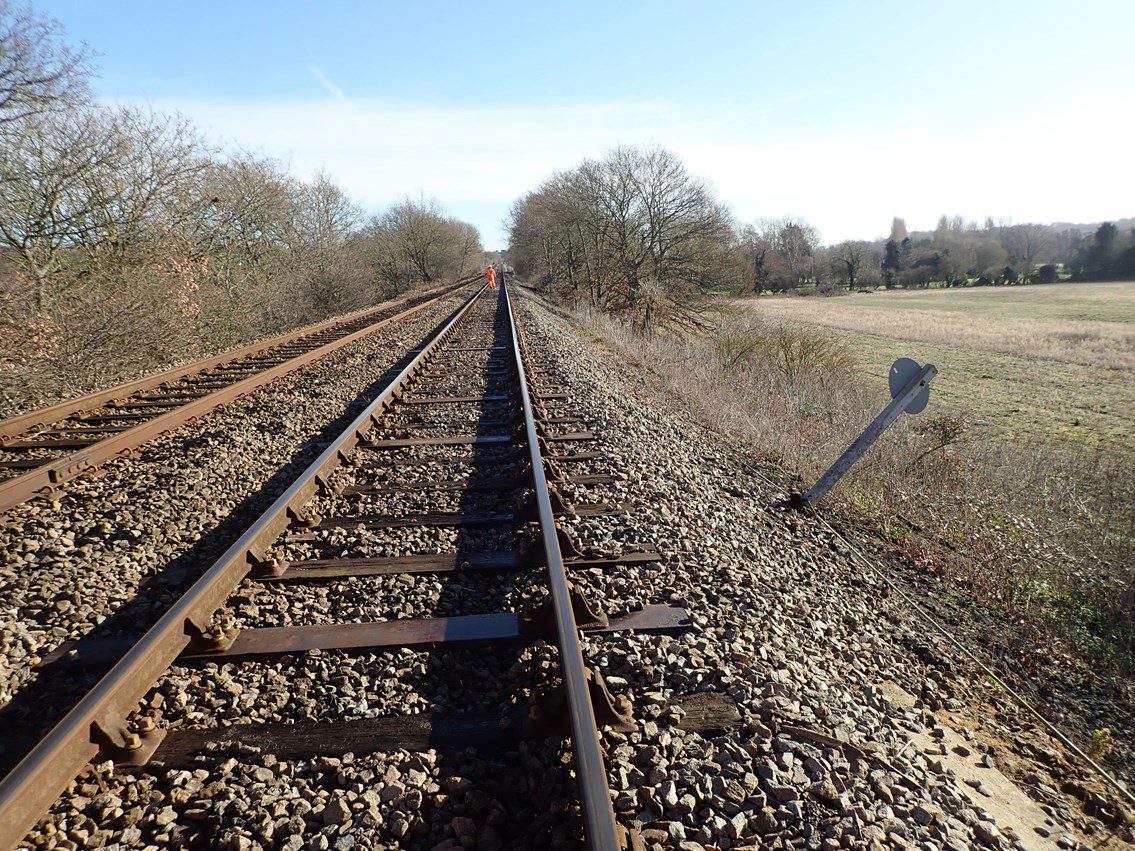 Before the works - signage slipping down the deteriorating embankment