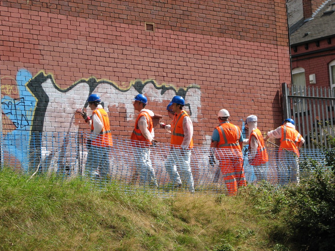 Graffiti removal at Burley Park station_001: Young people who have comitted offences in Leeds remove graffiti at Burley Park station as part of their reparation work.
In partnership with Network Rail