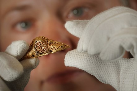Senior Curator Dr Alice Blackwell holds the rare early medieval gold sword pommel. Photo © Stewart Attwood (2)