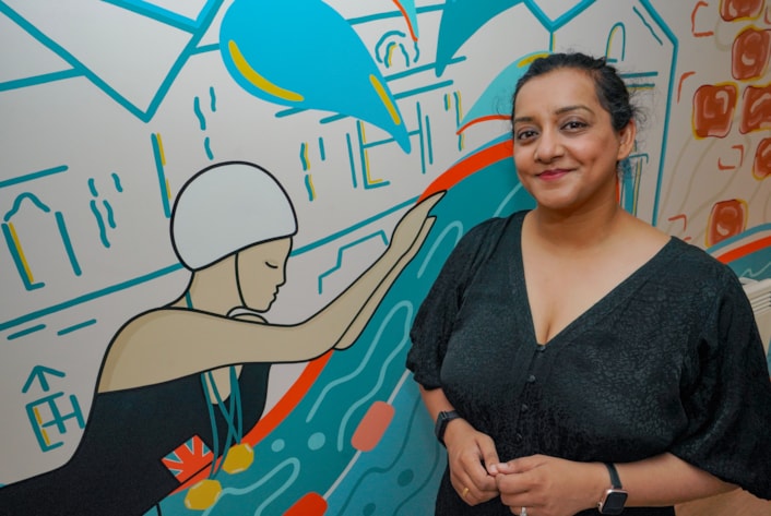 On the Pitch, Off the Pitch Murals: Among the inspiring figures selected to feature in murals are Kadeena Cox and swimmer Doris Storey. Pictured is Cllr Salma Arif with the new mural of Doris Storey.
Elsewhere a vibrant mural depicting the city’s rich dance heritage adorns the Northern School of Contemporary Dance and a dynamic piece celebrating the city’s rising skateboarding stars has been unveiled at Leeds Dock.
And a tribute to the Leeds Caribbean Cricket Club is a new feature at Kirkgate Market