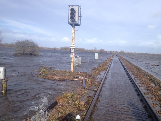 Media Update: trains running to Exeter again: Water covering the railway at Bridgewater - there are actually two tracks here