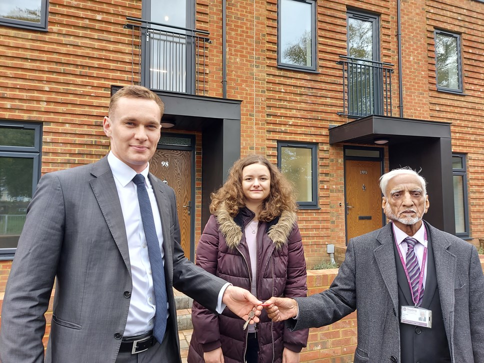Reading's Lead Councillor for Housing Ellie Emberson and Battle ward councillor Gul Khan receive the keys from NFC Homes' Richard Hibbert