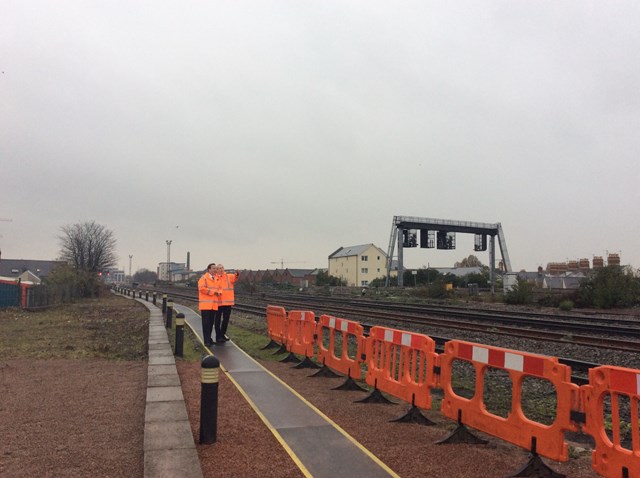 Mark Langman, route managing director for Network Rail Wales, shows the Prime Minister the railway tracks outside the Wales rail operating centre in Cardiff