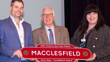 Three people smiling holding a sign that reads: 2023 Cheshire Best Kept Station, Macclesfield, Chris Dale TravelWatch Award.