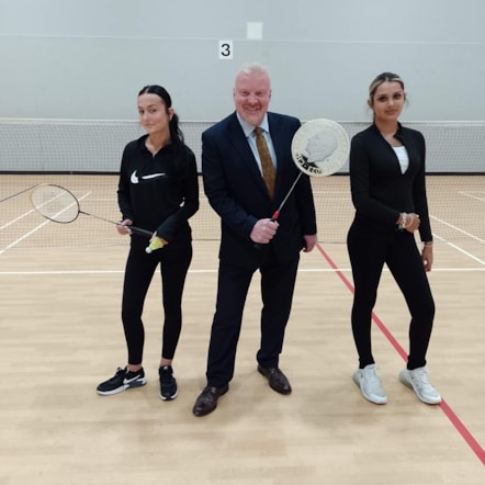 Left to right Ellie Reed, Cllr Corfield and Isobel Bearman play Badminton at Duncan Edwards Leisure Centre