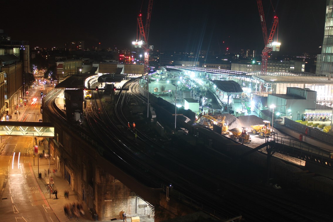 Ballast is delivered on the approach to the new Borough Market viaduct: Night falls on London Bridge on Saturday, September 12, while the first ballast is is delivered for the new Borough Market viaduct. A Cannon Street train calls at platform 2