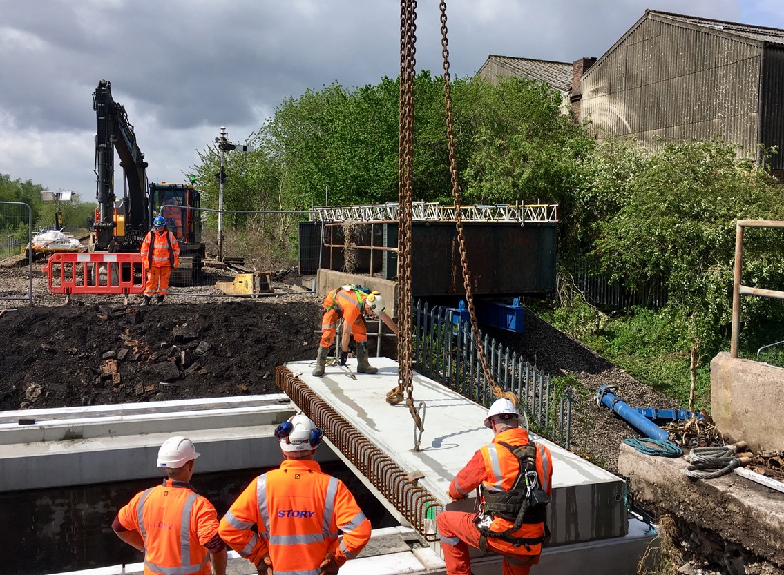 Concrete sections being lowered into place by crane at Bute Street in Stoke-on-Trent